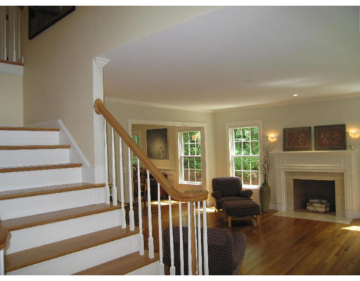 41 Woodcliffe Road Lexington, MA 02421 - Photo 7 of 26 a living room with furniture and a fireplace