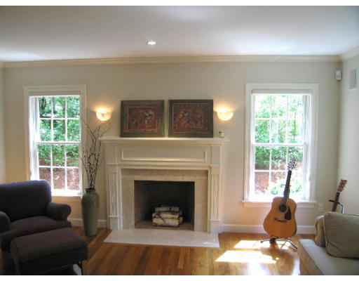 41 Woodcliffe Road Lexington, MA 02421 - Photo 9 of 26 a living room with furniture a window and a fireplace