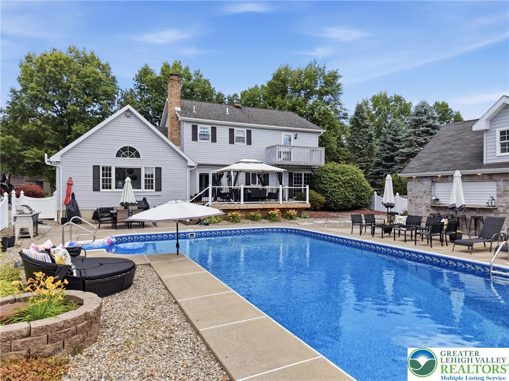 890 Lahr Road Nazareth, PA 18064 - Photo 3 of 74 a view of a house with swimming pool and sitting area