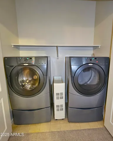 a utility room with dryer and washer