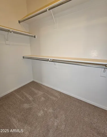 a view of a livingroom with a ceiling fan and window