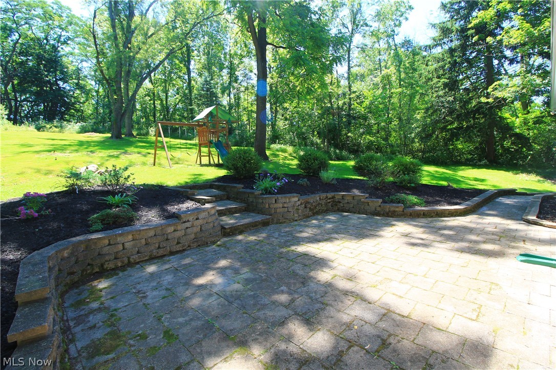 386 East Garfield Road Aurora, OH 44202 - Photo 28 of 35 Paver Patio w/Perennial Gardens