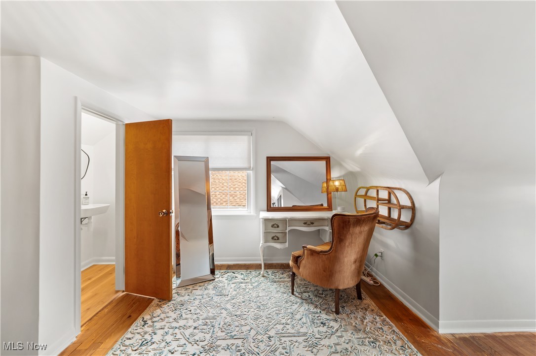 4648 Ammon Road Cleveland, OH 44143 - Photo 29 of 48 Living area featuring light hardwood and lofted ceiling