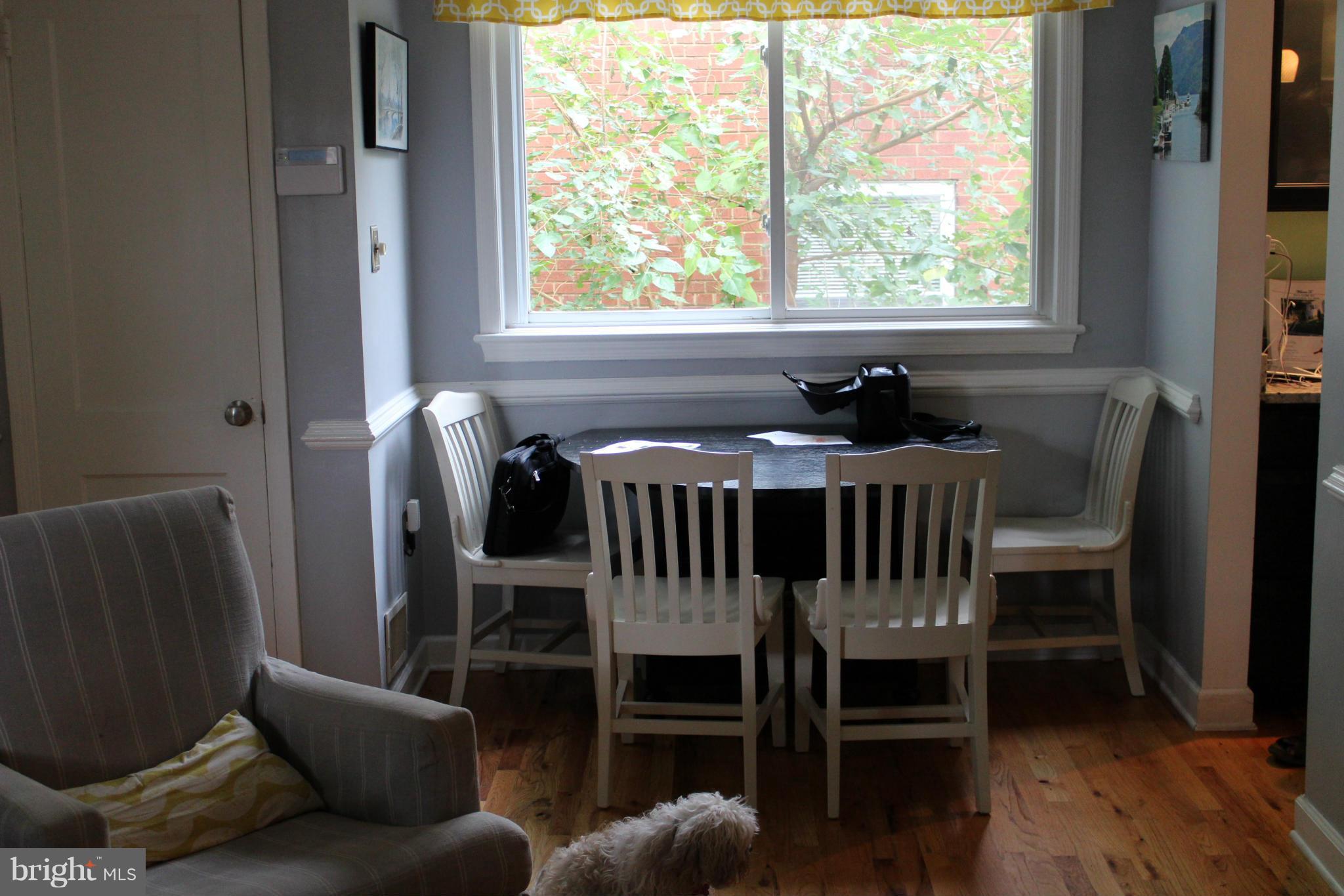 204 West Glebe Road Alexandria, VA 22305 - Photo 14 of 26 a view of a dining room with furniture and wooden floor