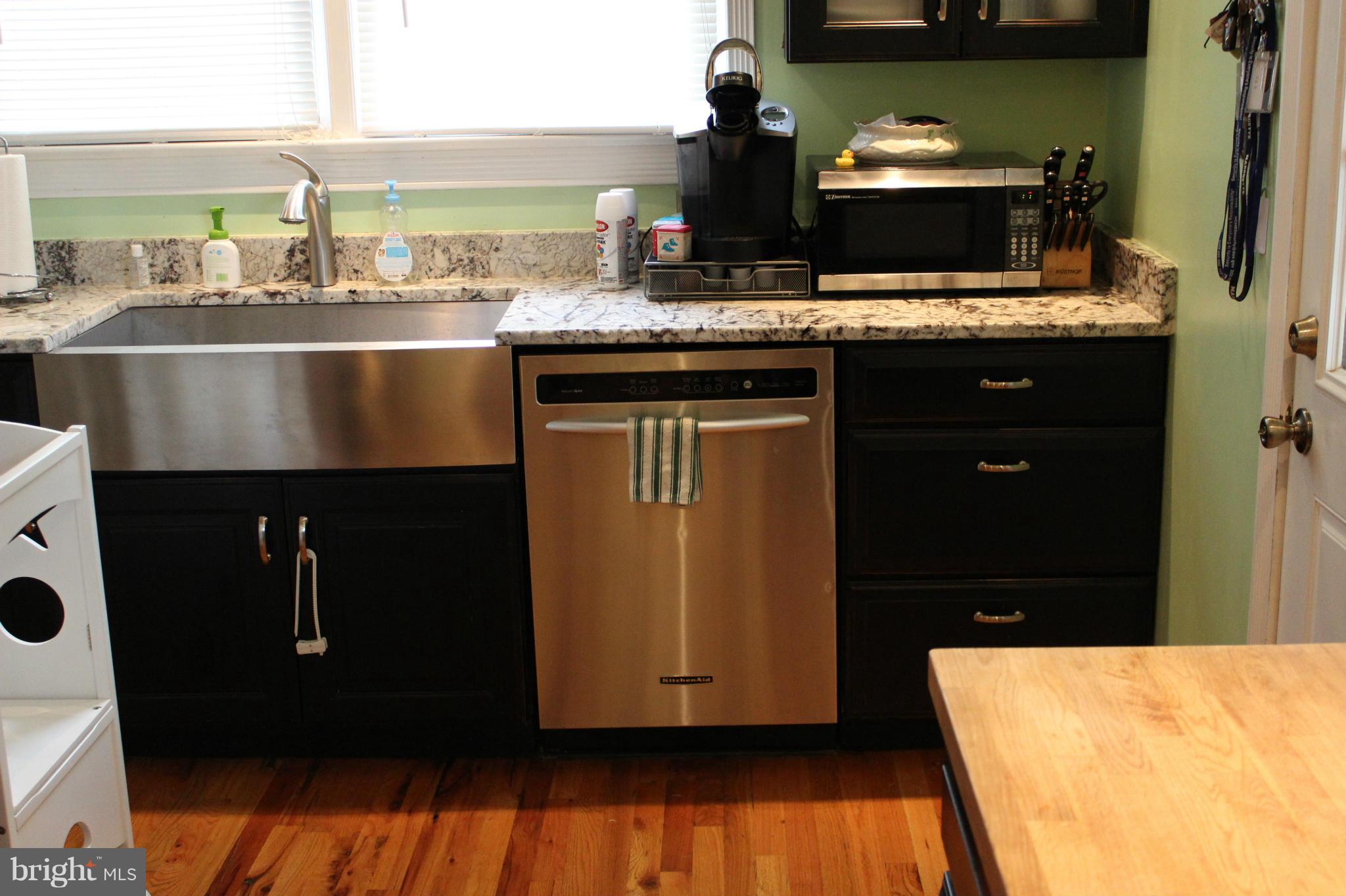 204 West Glebe Road Alexandria, VA 22305 - Photo 4 of 26 a kitchen with a sink and wooden floor