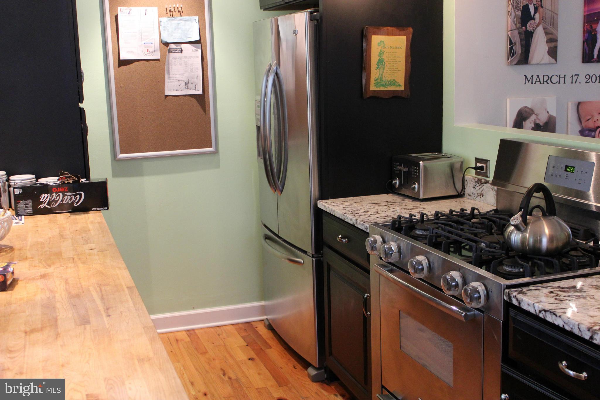 204 West Glebe Road Alexandria, VA 22305 - Photo 8 of 26 a kitchen with a stove and a refrigerator