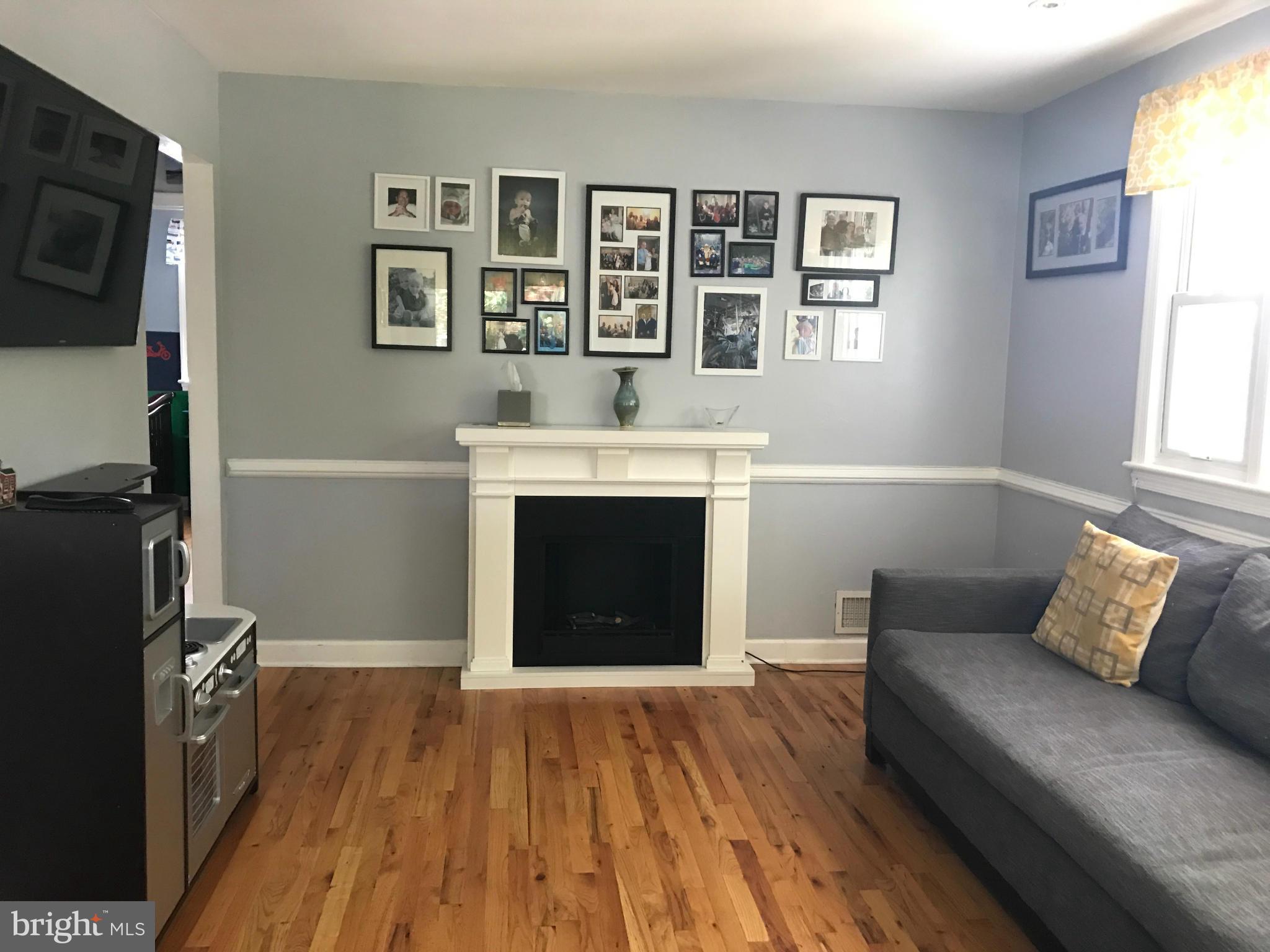 204 West Glebe Road Alexandria, VA 22305 - Photo 9 of 26 a living room with furniture and a fireplace