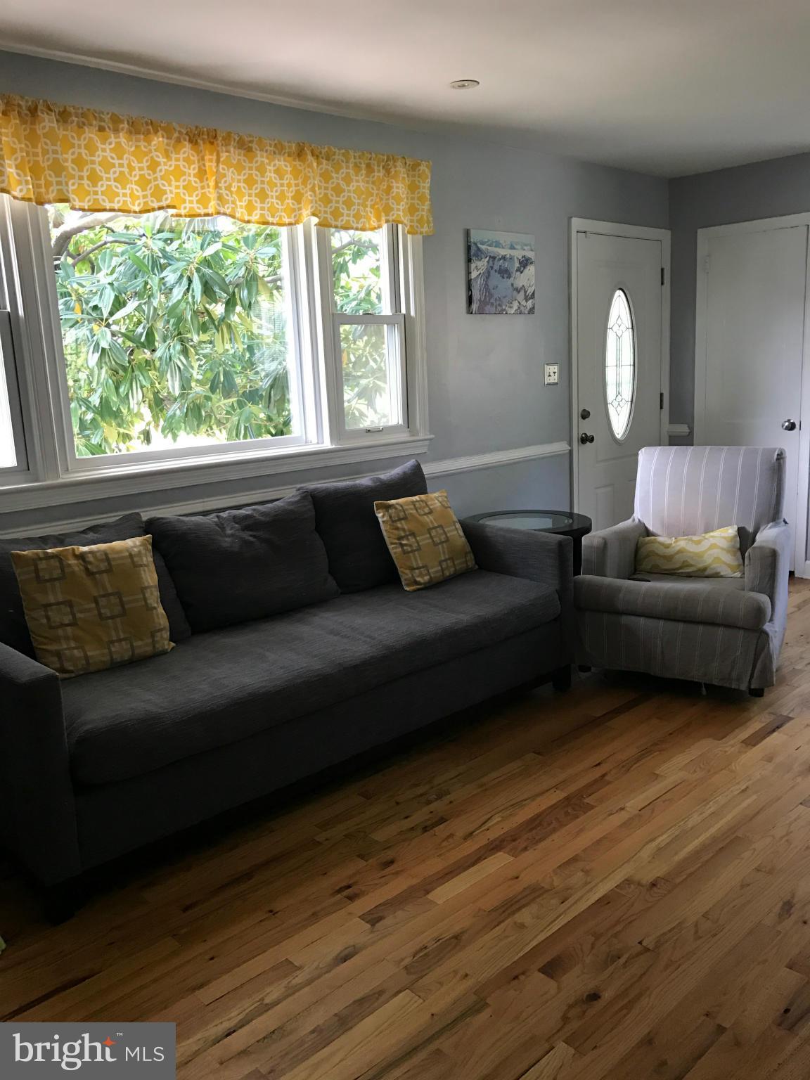 204 West Glebe Road Alexandria, VA 22305 - Photo 10 of 26 a living room with furniture and a large window