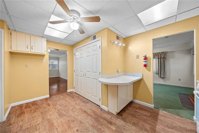 a view of kitchen with furniture and wooden floor