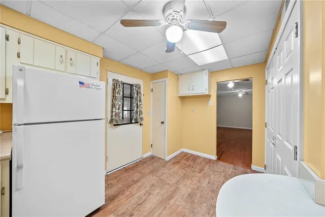 a white refrigerator freezer sitting in a kitchen