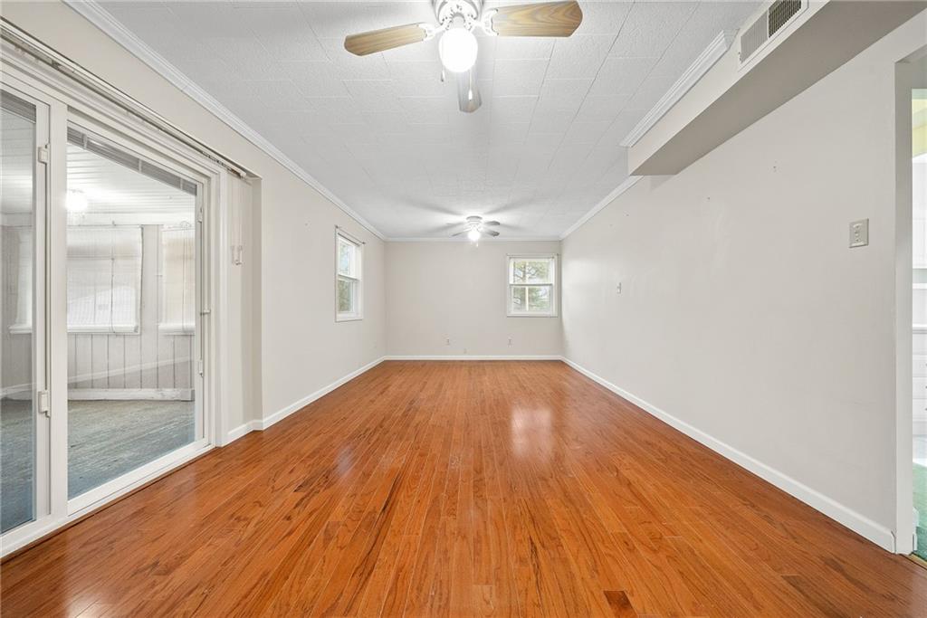 185 Walnut Street Beaver, PA 15009 - Photo 15 of 43 a view of empty room with wooden floor and fan