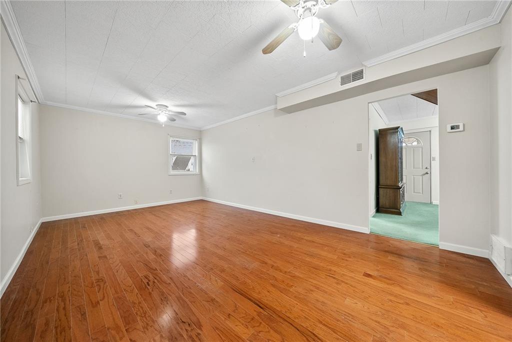 185 Walnut Street Beaver, PA 15009 - Photo 16 of 43 wooden floor in an empty room with a window