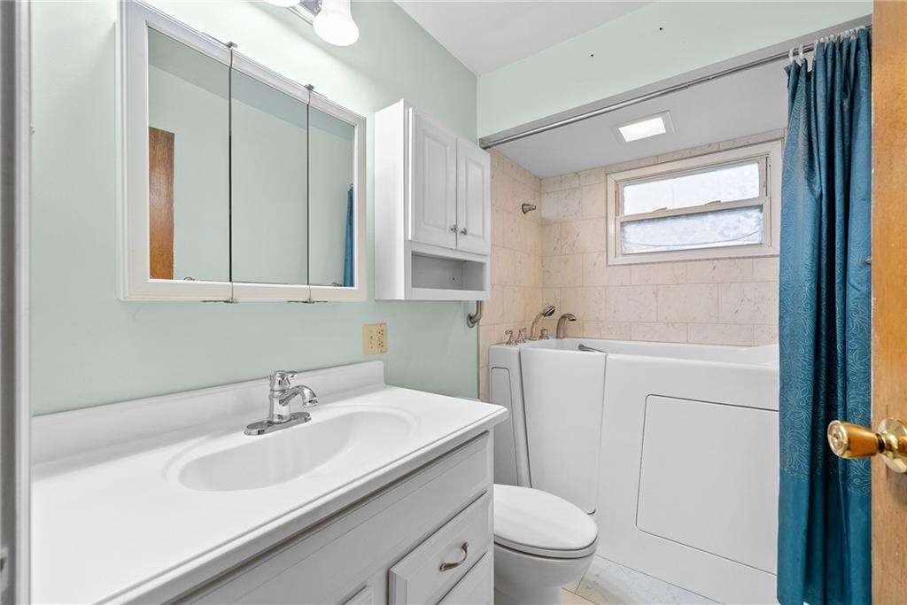 185 Walnut Street Beaver, PA 15009 - Photo 18 of 43 a bathroom with a sink toilet and mirror