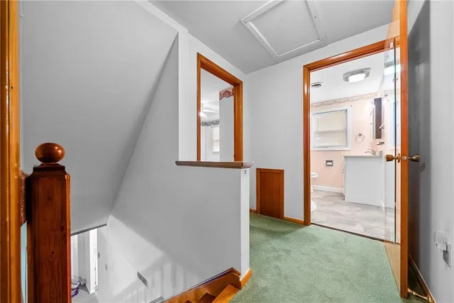 a view of a hallway with windows