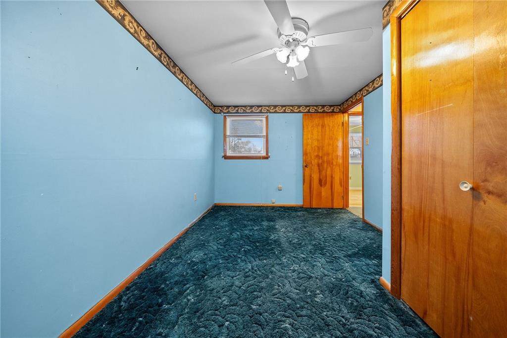 185 Walnut Street Beaver, PA 15009 - Photo 23 of 43 a view of a big room with chandelier fan and windows
