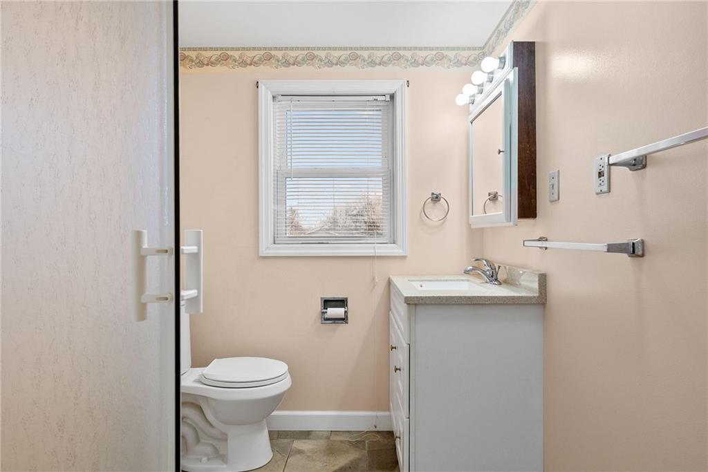 185 Walnut Street Beaver, PA 15009 - Photo 24 of 43 a bathroom with a toilet sink and mirror