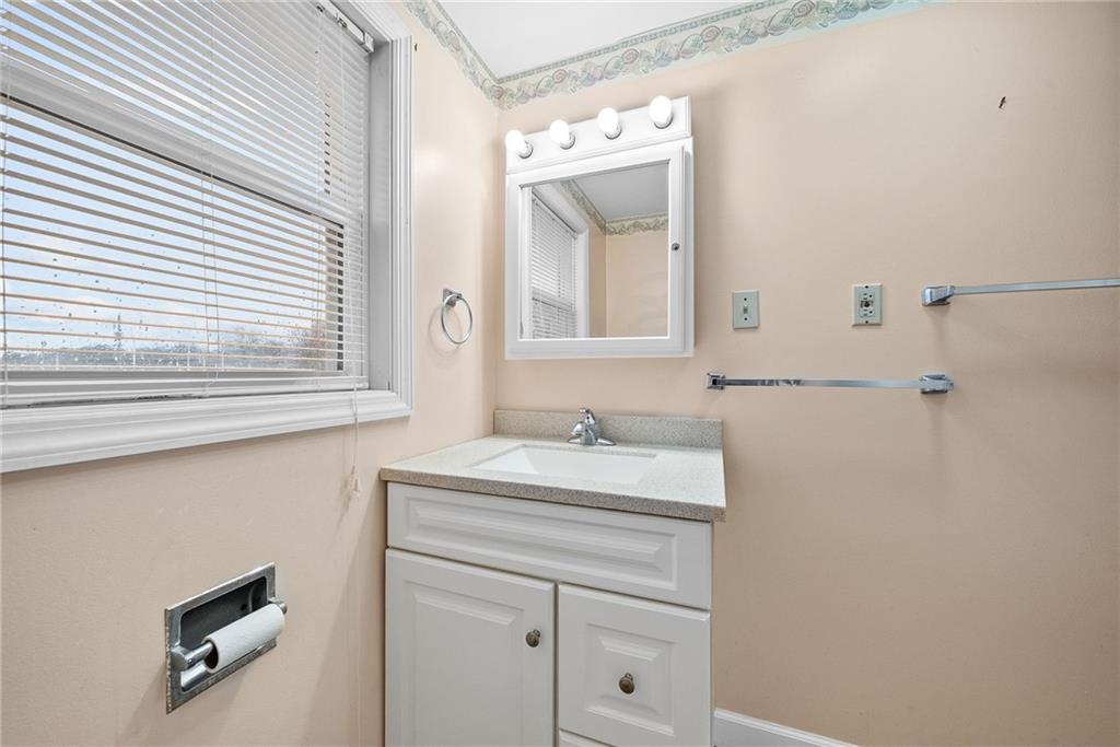 185 Walnut Street Beaver, PA 15009 - Photo 26 of 43 a bathroom with a sink a vanity and a mirror