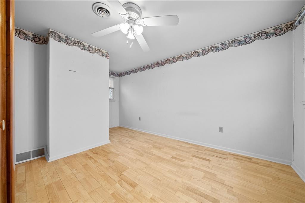 185 Walnut Street Beaver, PA 15009 - Photo 29 of 43 a view of a big room with carpet and a chandelier fan