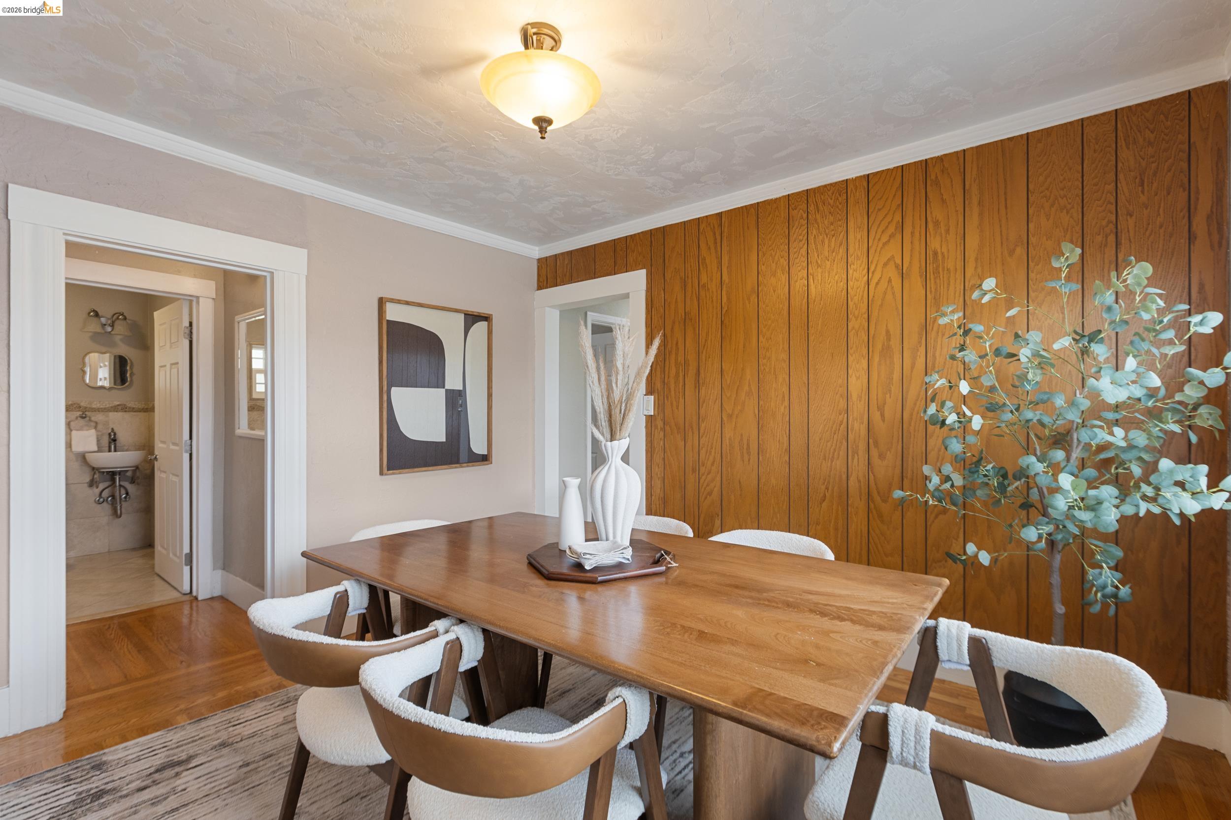 2316 Ransom Avenue Oakland, CA 94601 - Photo 12 of 37 a dining room with furniture and wooden floor
