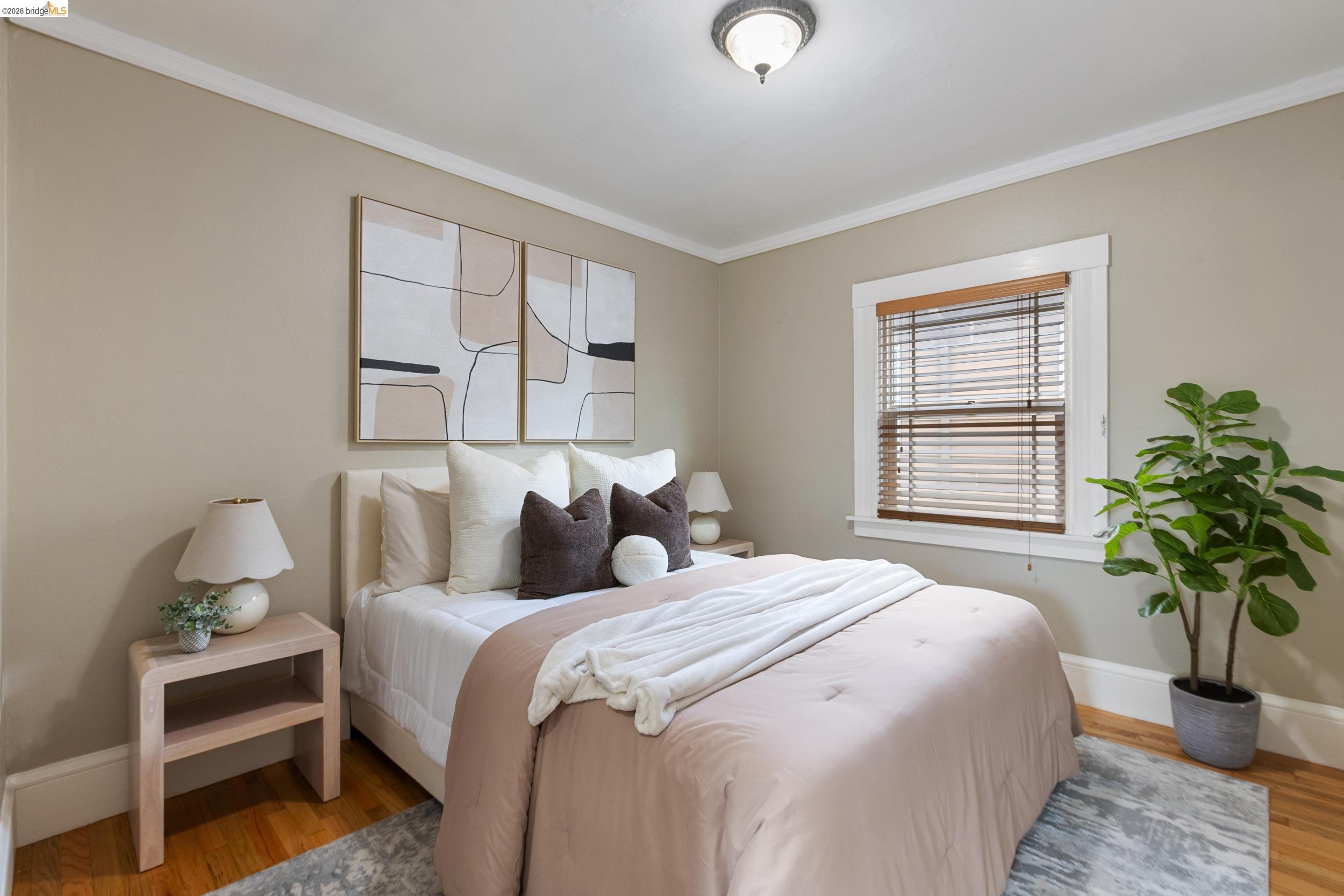 2316 Ransom Avenue Oakland, CA 94601 - Photo 23 of 37 a bedroom with bed and a potted plant