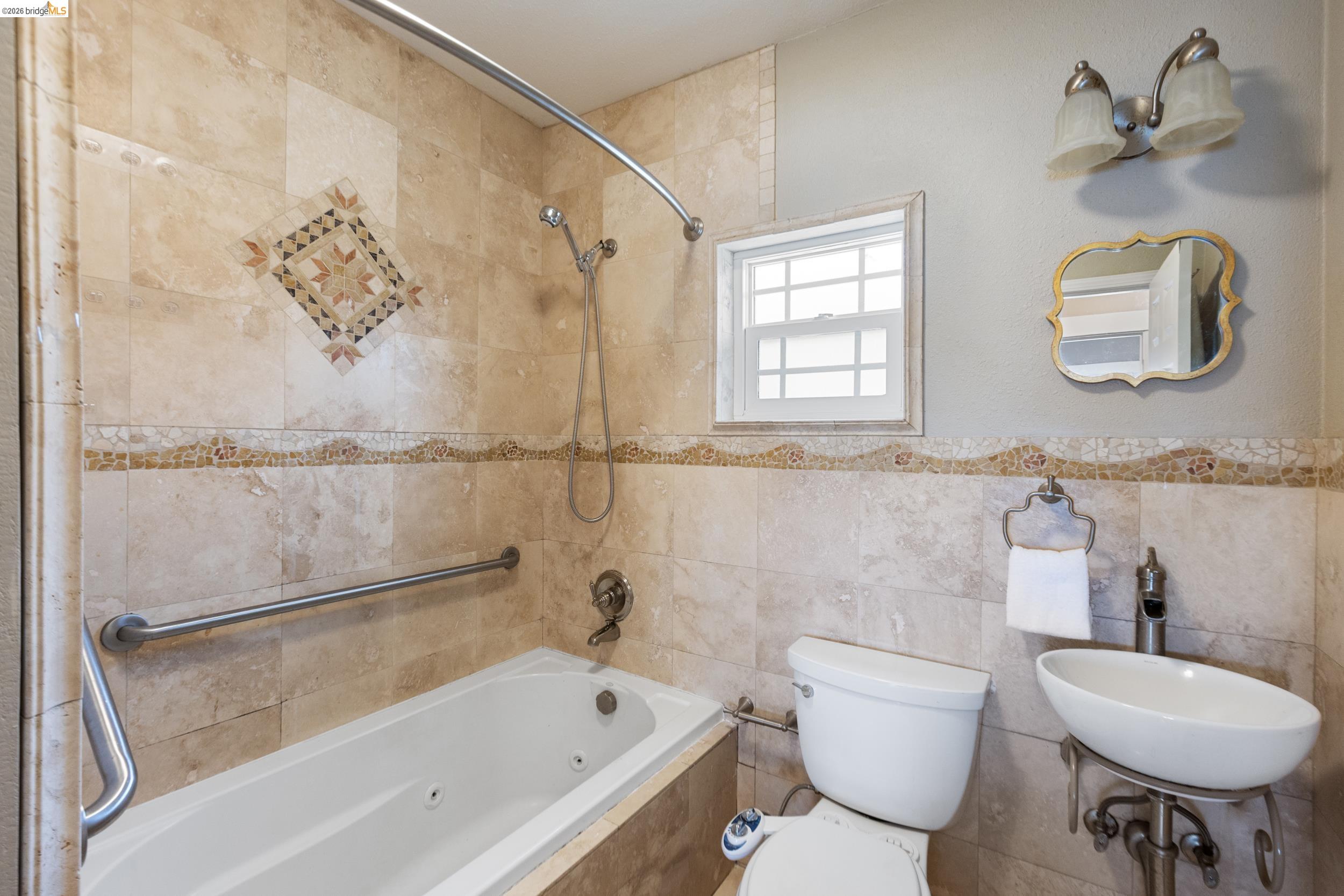 2316 Ransom Avenue Oakland, CA 94601 - Photo 25 of 37 a bathroom with a sink toilet and shower