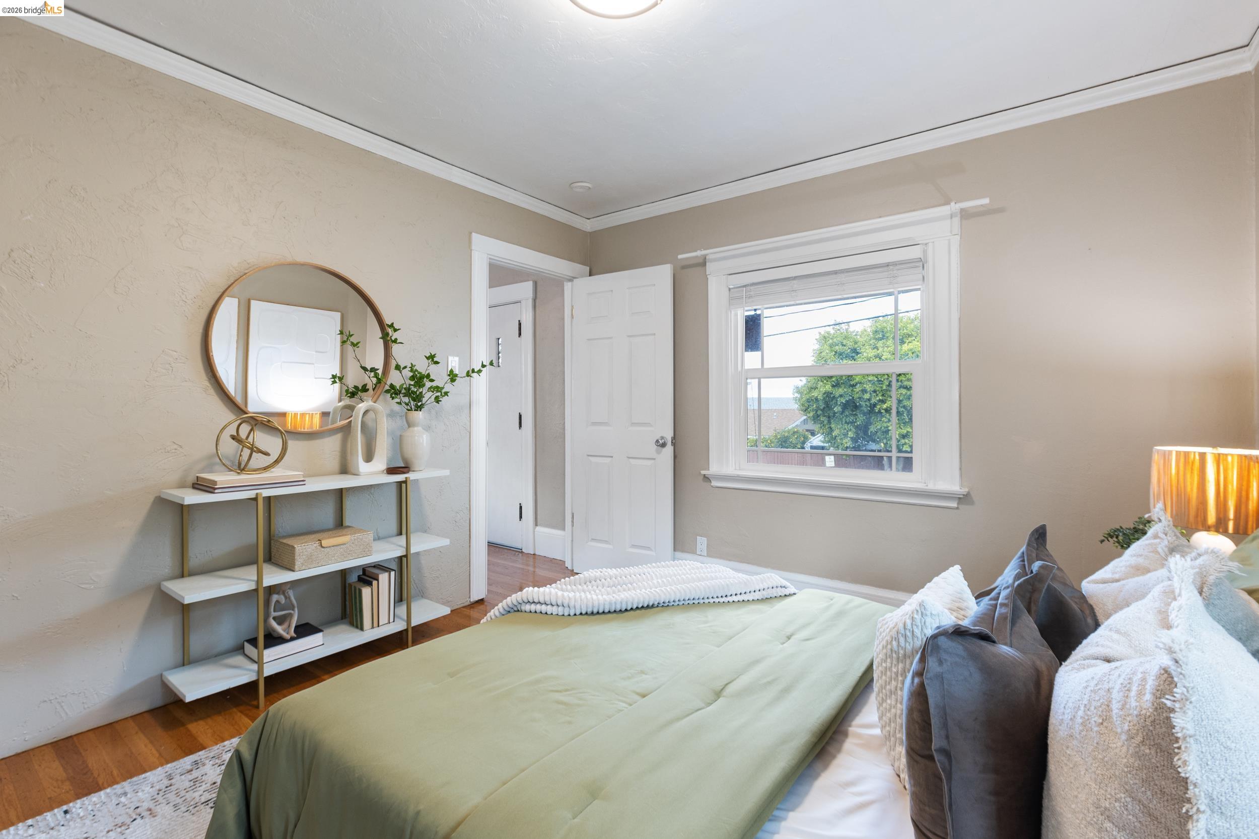2316 Ransom Avenue Oakland, CA 94601 - Photo 27 of 37 a bedroom with a bed and a large window