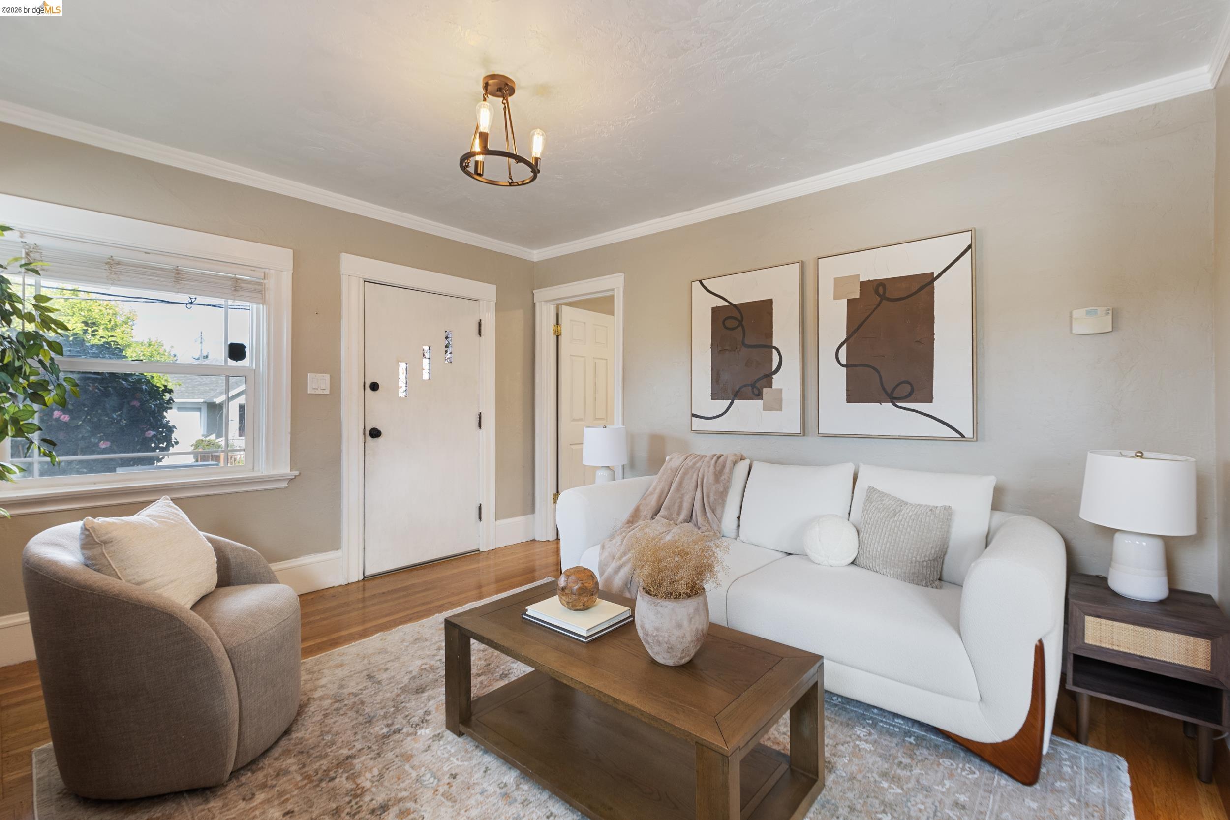 2316 Ransom Avenue Oakland, CA 94601 - Photo 8 of 37 a living room with furniture and a large window