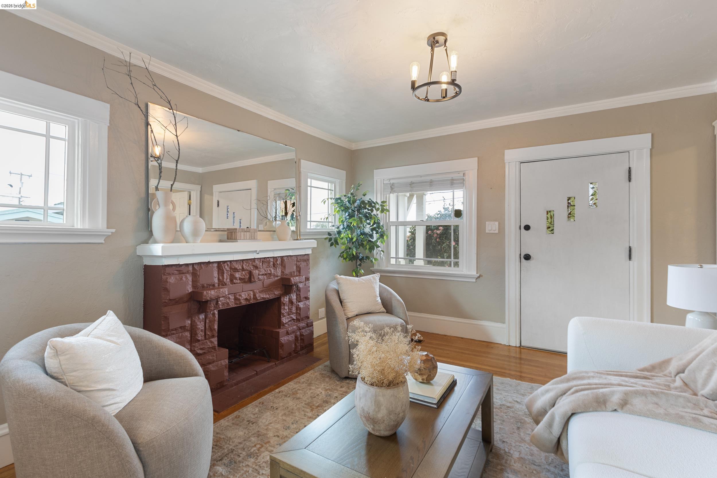 2316 Ransom Avenue Oakland, CA 94601 - Photo 9 of 37 a living room with furniture and a fireplace
