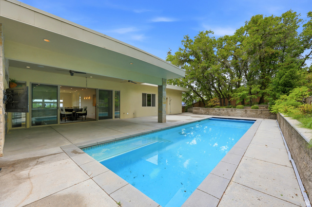1389 Millbrook Way Bountiful, UT 84010 - Photo 61 of 74 Rectangular pool with concrete surround and a covered patio area