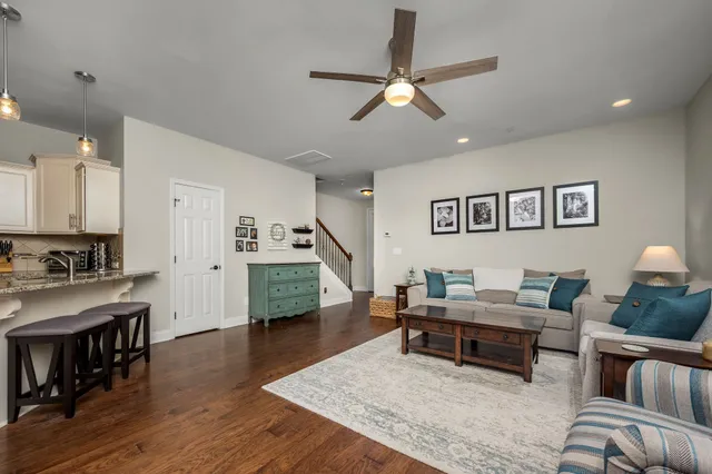 a kitchen with a refrigerator sink and cabinets