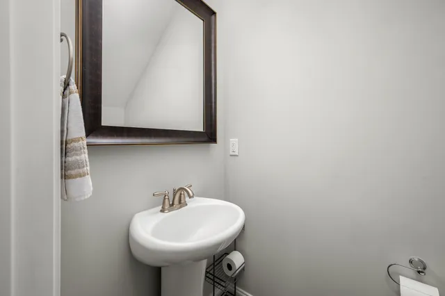a living room with furniture and a bookshelf