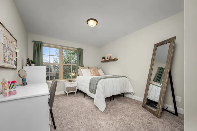 a bedroom with furniture and window