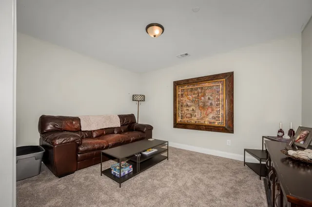 a bathroom with a shower a toilet and a sink