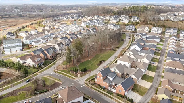 a view of multiple houses with outdoor space