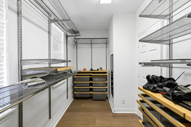 a kitchen with stainless steel appliances a stove and a window