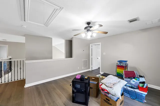 a room with furniture and wooden floor