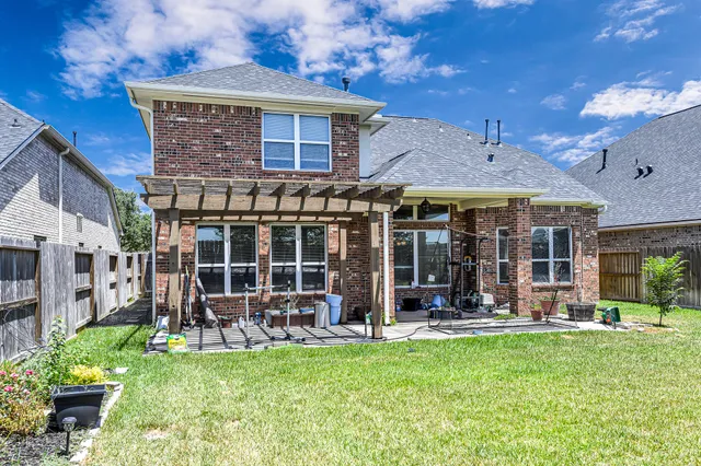 a view of a house with sitting area and garden