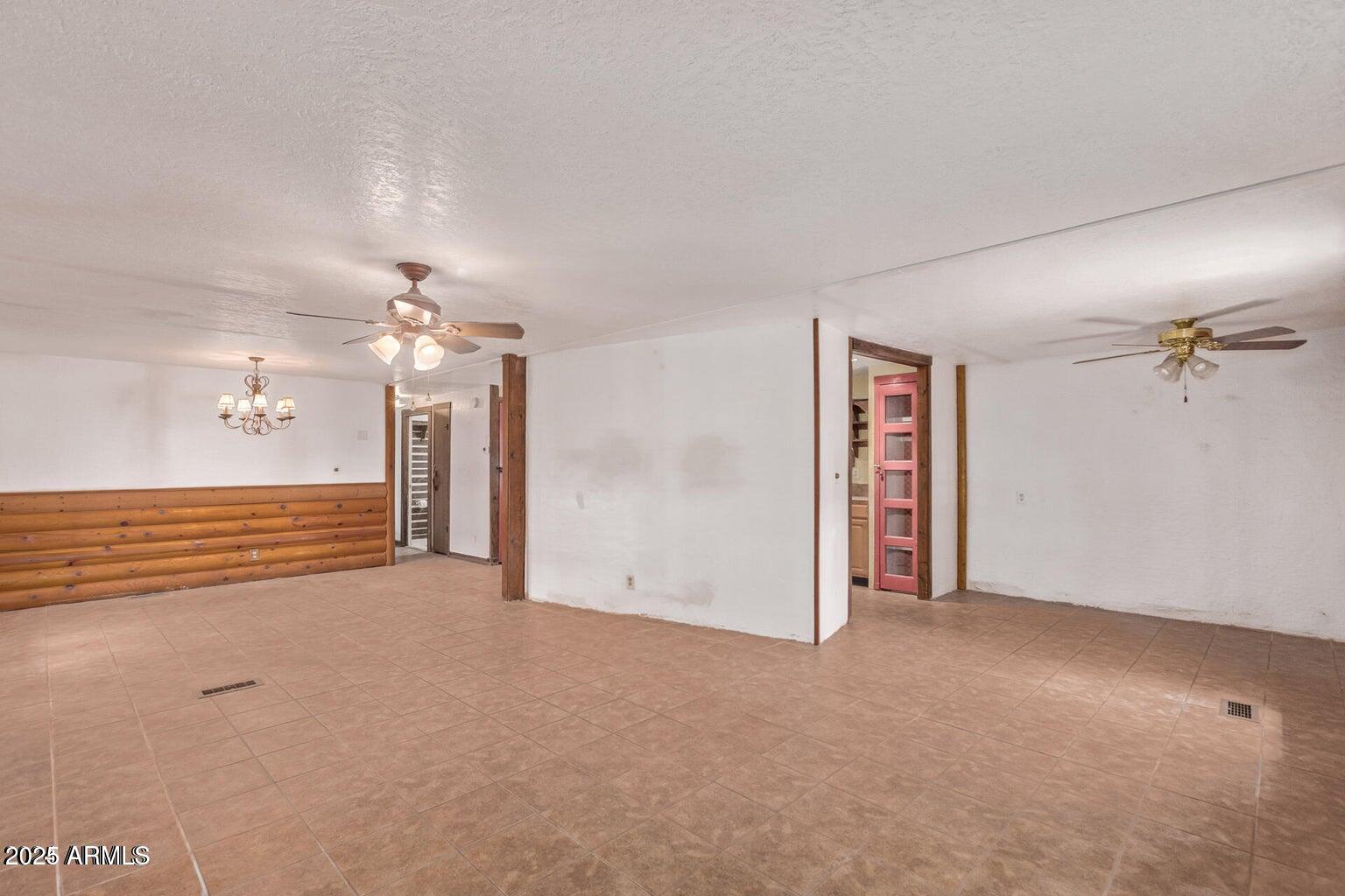 201 South Greenfield Road, Unit 331 Mesa, AZ 85206 - Photo 16 of 49 an empty room with windows and fan