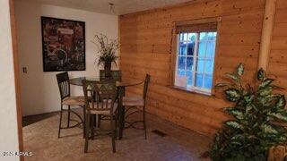 201 South Greenfield Road, Unit 331 Mesa, AZ 85206 - Photo 25 of 49 a view of a dining room with furniture and chandelier