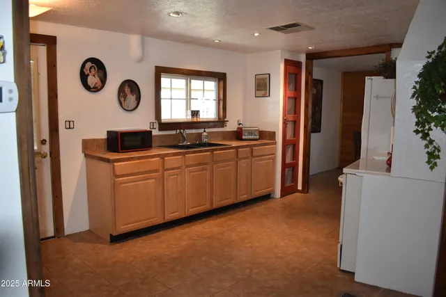 a room with water heater and a window