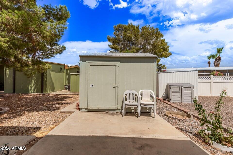 201 South Greenfield Road, Unit 331 Mesa, AZ 85206 - Photo 45 of 49 a view of a chair and table in the house