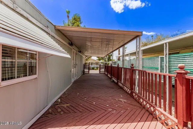 a view of wooden floor and windows in a room