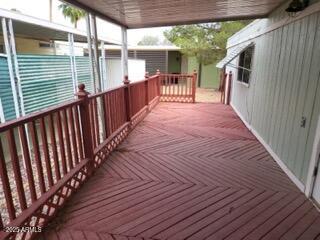 201 South Greenfield Road, Unit 331 Mesa, AZ 85206 - Photo 8 of 49 a porch with wooden floor in front of house
