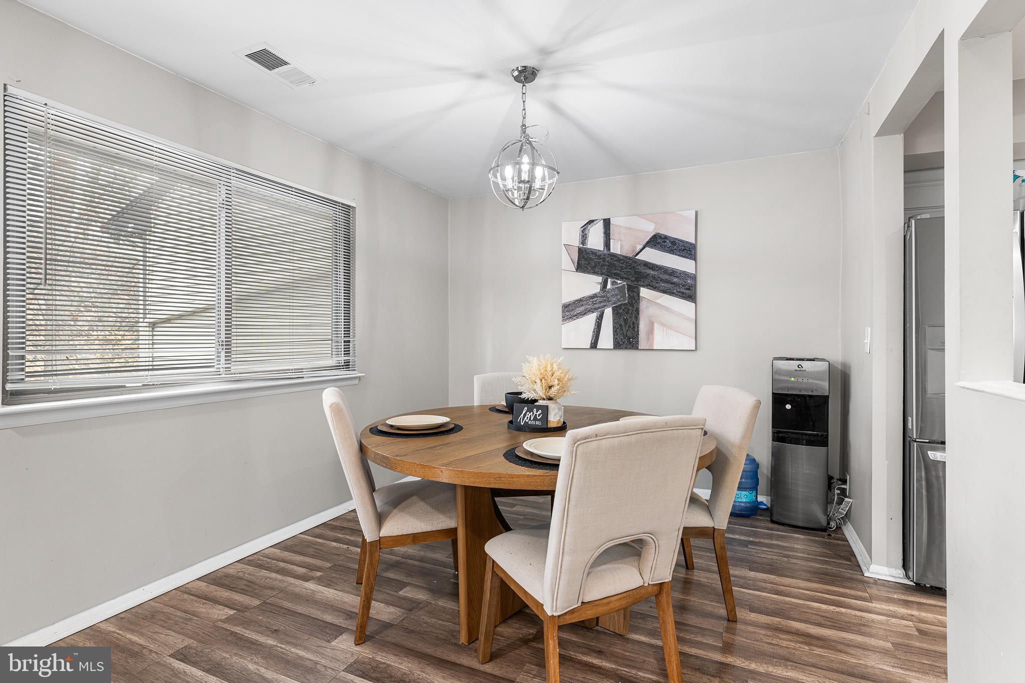 115 East Kings Highway, Unit 186 Maple Shade, NJ 08052 - Photo 7 of 25 a view of a dining room with furniture window and wooden floor