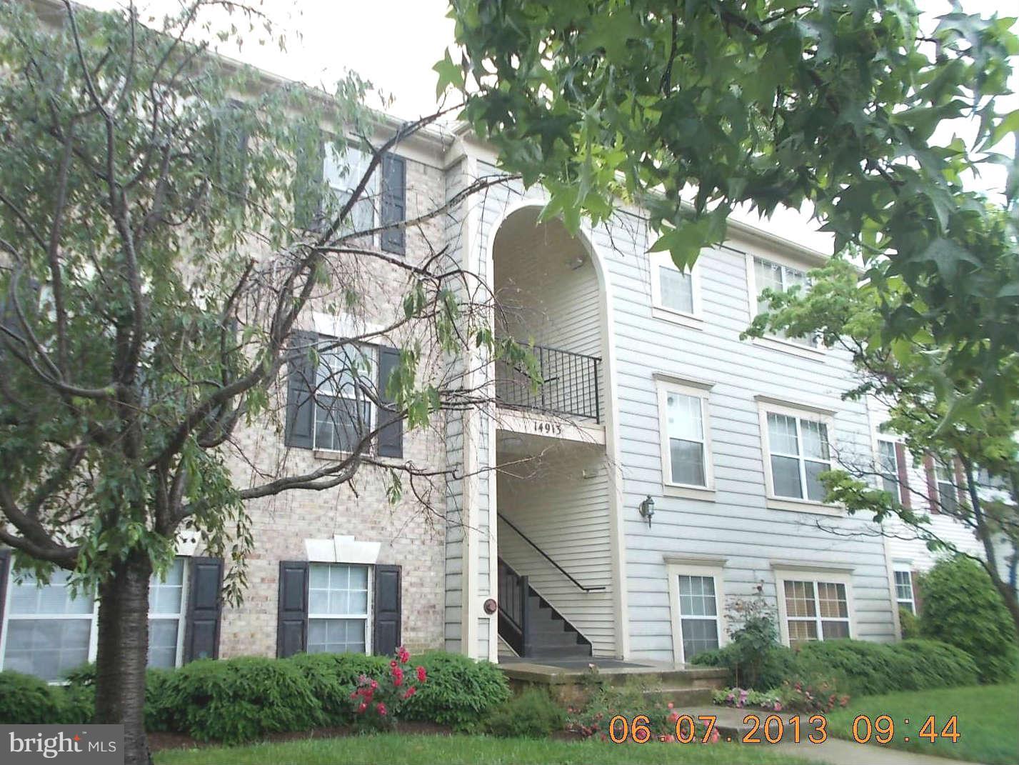 14913 Cleese Court, Unit C Silver Spring, MD 20906 - Photo 1 of 20 a view of a building with a tree