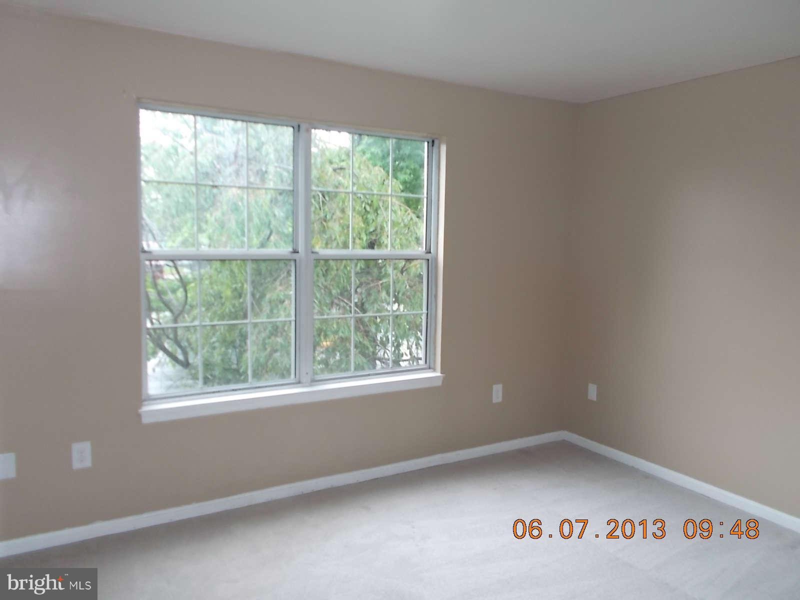 14913 Cleese Court, Unit C Silver Spring, MD 20906 - Photo 16 of 20 a view of an empty room with a window