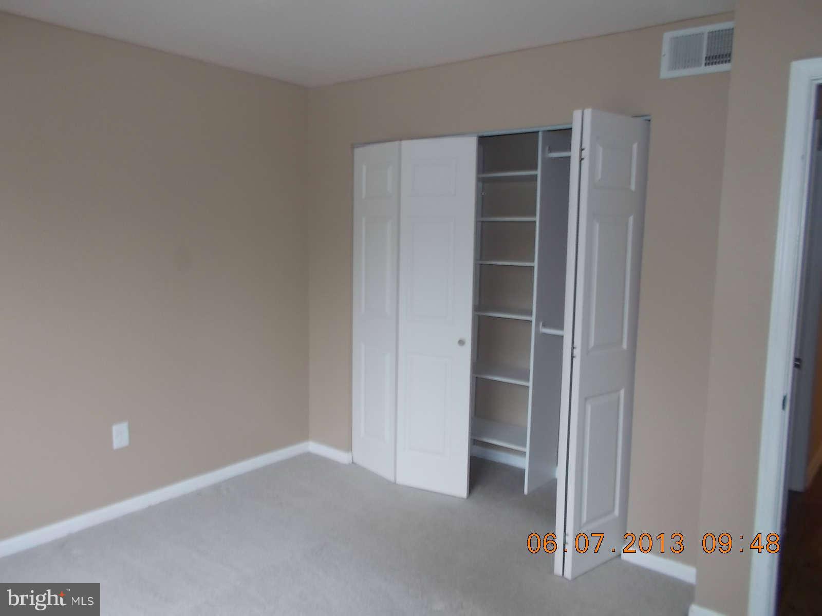 14913 Cleese Court, Unit C Silver Spring, MD 20906 - Photo 17 of 20 a view of an empty room with closet and a window