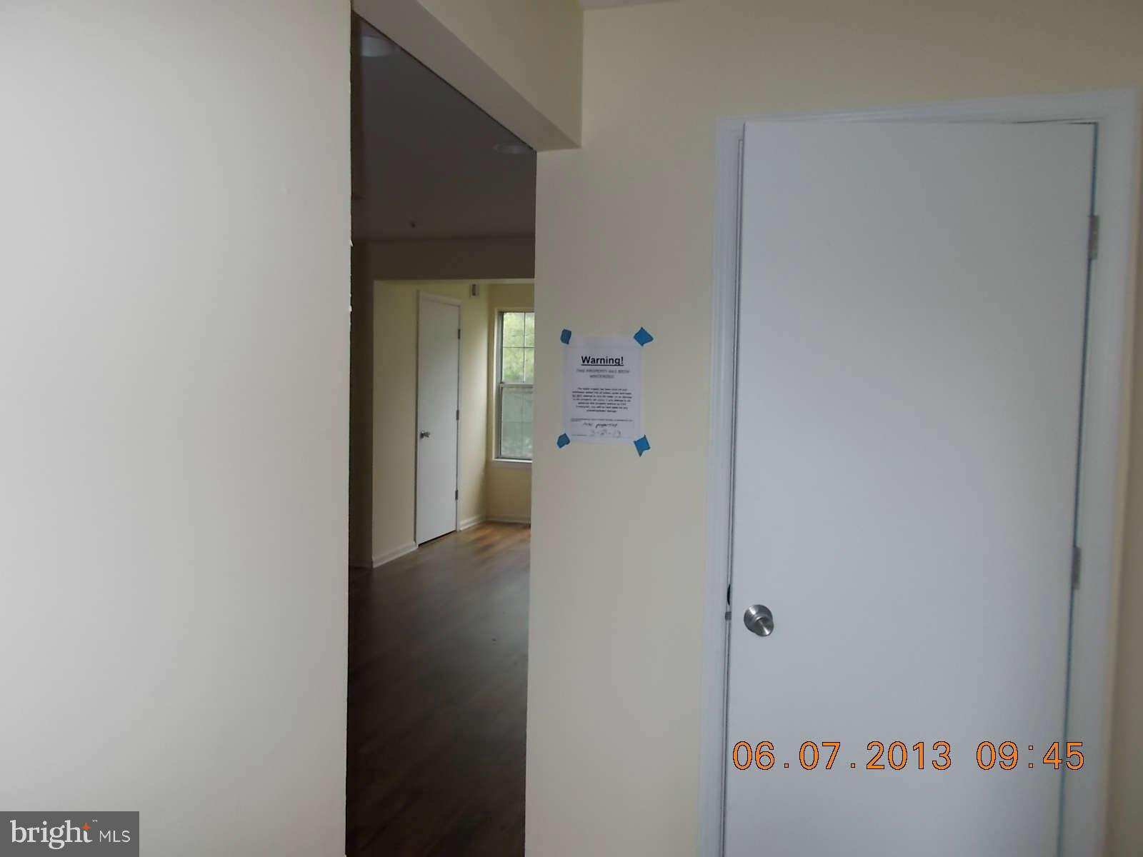 14913 Cleese Court, Unit C Silver Spring, MD 20906 - Photo 5 of 20 a view of a hallway with closet