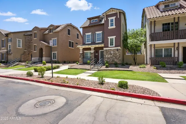 a view of a big building with a swimming pool