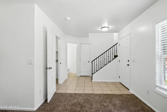 a view of entryway with wooden floor and a rug